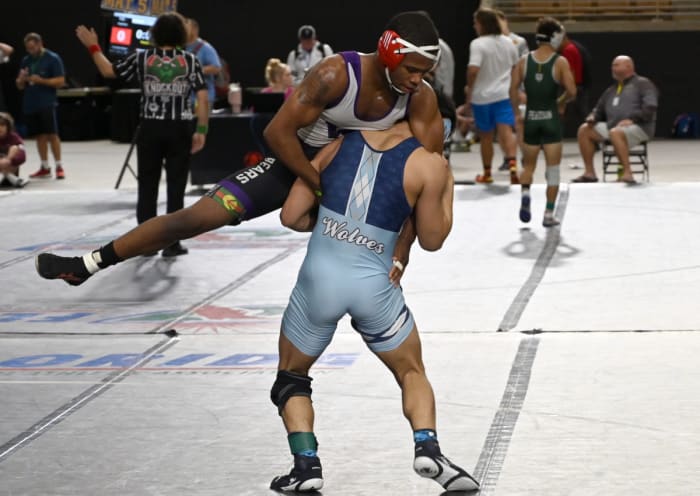Jaydon Robinson of Winter Spring advances to the finals with a win against Kyle Lew of Houston Westside during a 144-pound semifinals match on Saturday at the Knockout Christmas Classic at Silver Spurs Arena in Kissimmee.